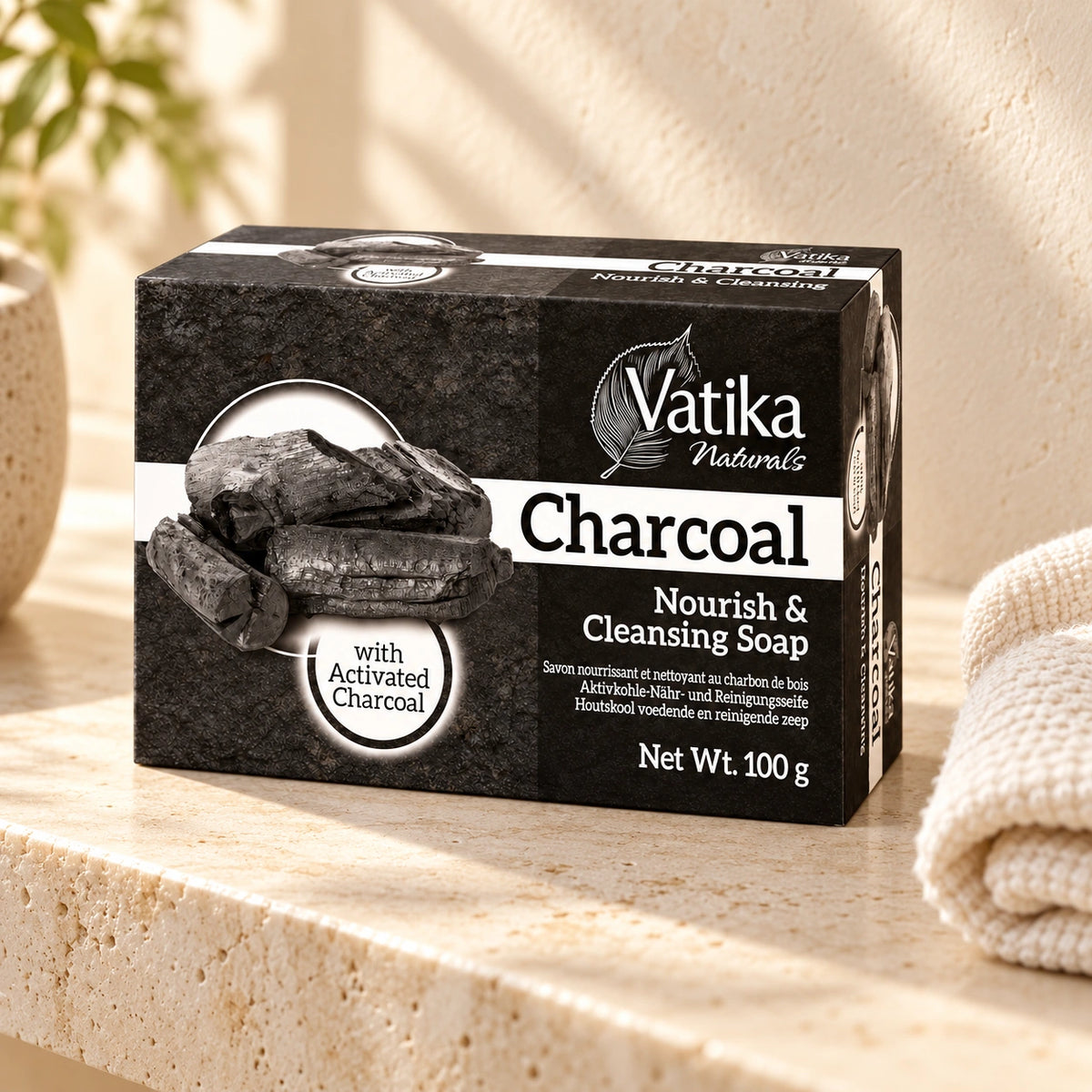 Vatika Naturals Charcoal Soap 100g on a limestone shelf with cream towels
