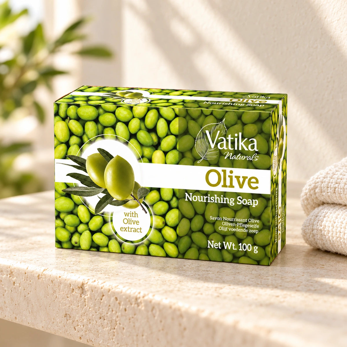Vatika Naturals Olive Soap 100g on a limestone shelf with cream towels