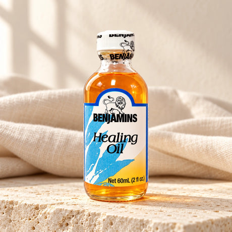 Benjamins Healing Oil 60ml bottle on pale stone with neutral linen