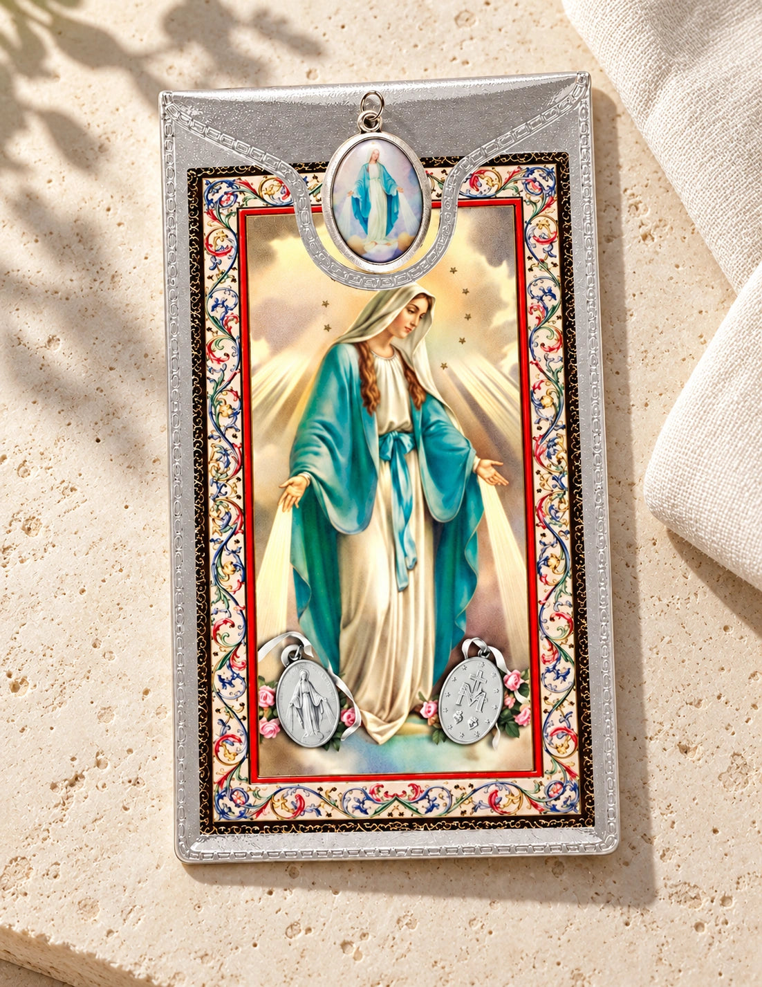 Miraculous Medal & Foil Leaflet Prayer Card styled on pale stone with linen