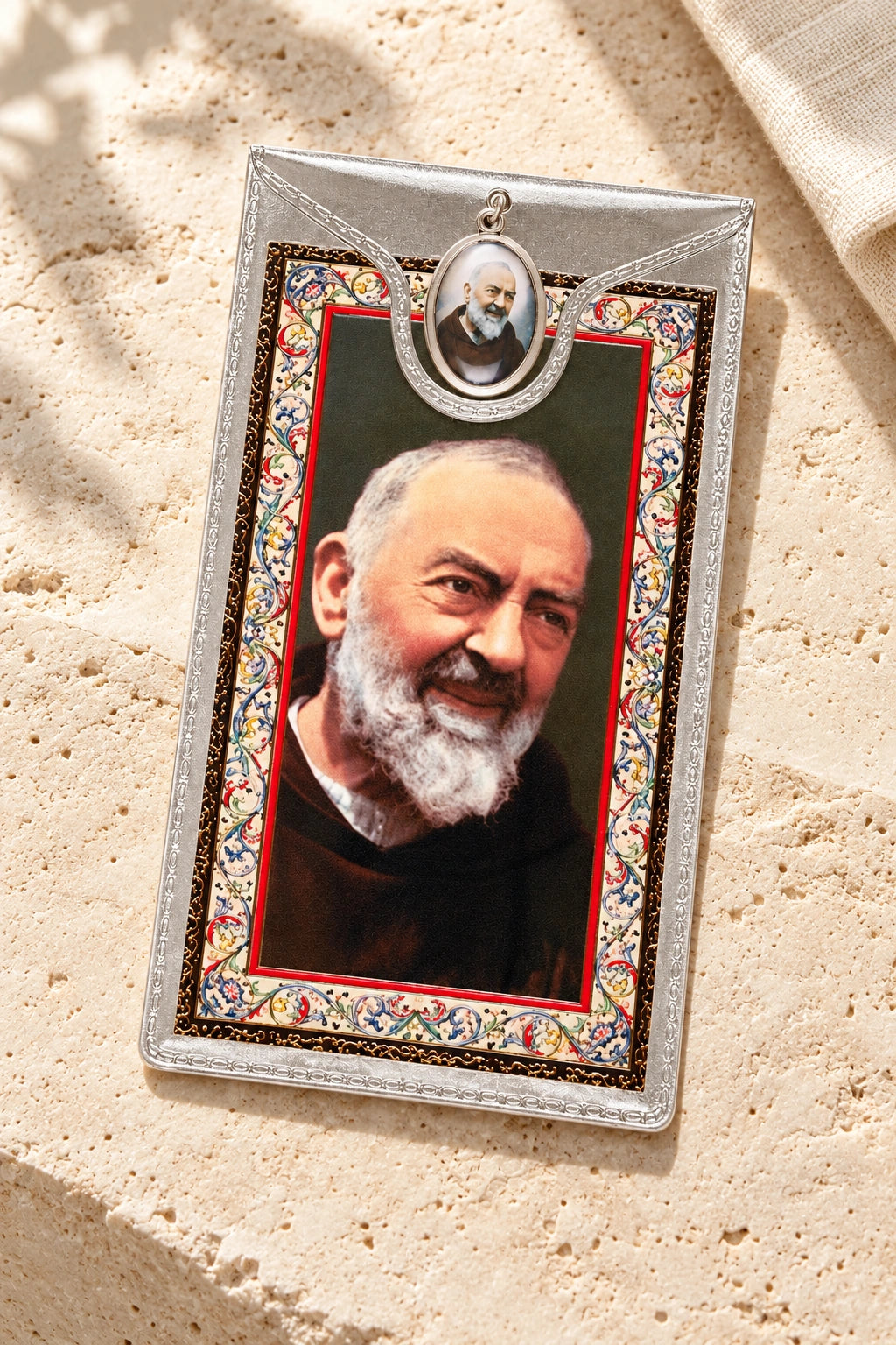 Saint Pio Medal & Foil Leaflet Prayer Card styled on pale stone with linen