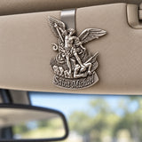 Saint Michael Pewter Car Visor Clip attached to a car sun visor
