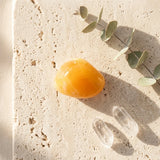 Tumbled Stone — Spiritual Wellness Flat Lay | Generated by Modelize