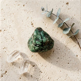 Tumbled gemstone — Spiritual Wellness Flat Lay | Generated by Modelize