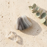 Tumbled Agate Stone — Spiritual Wellness Flat Lay | Generated by Modelize