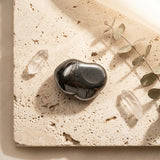 Tumbled Stone — Spiritual Wellness Flat Lay | Generated by Modelize