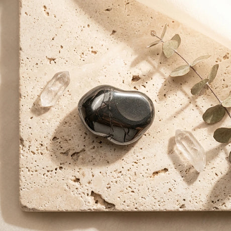 Tumbled Stone — Spiritual Wellness Flat Lay | Generated by Modelize