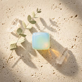 Tumbled Stone — Spiritual Wellness Flat Lay | Generated by Modelize