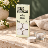 Petali Jasmine White Flowers 10-pack tealights styled on a stone console; holder and flowers are decorative props.