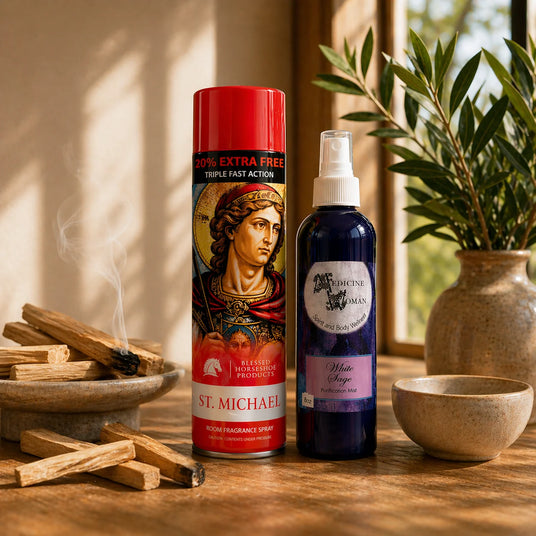 Spiritual aerosol sprays on a table beside a plant