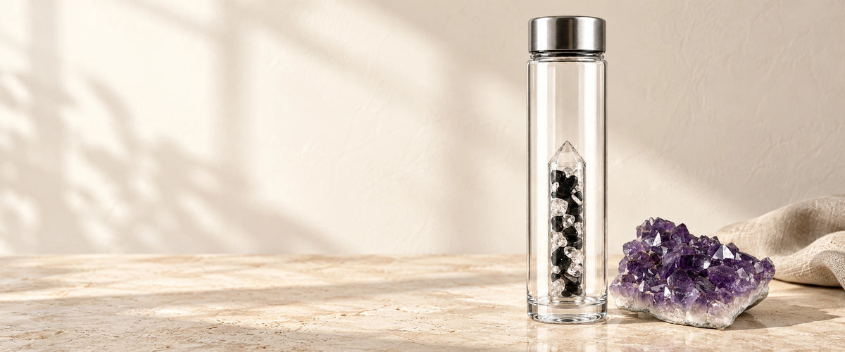 Crystal water bottle and amethyst cluster