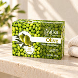 Vatika Naturals Olive Soap 100g on a limestone shelf with cream towels