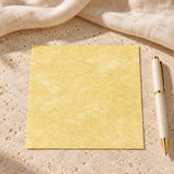 Virgin parchment paper 4 by 4 inch sheet in a neutral lifestyle setting